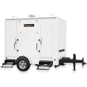 A white FusionSite two-stall restroom trailer with dual entry doors, air conditioning units, and metal steps for event or jobsite use.