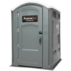A gray ADA-accessible portable restroom with a FusionSite logo on the front door, wider entrance, reinforced door handle, and ground-level access for wheelchair users.
